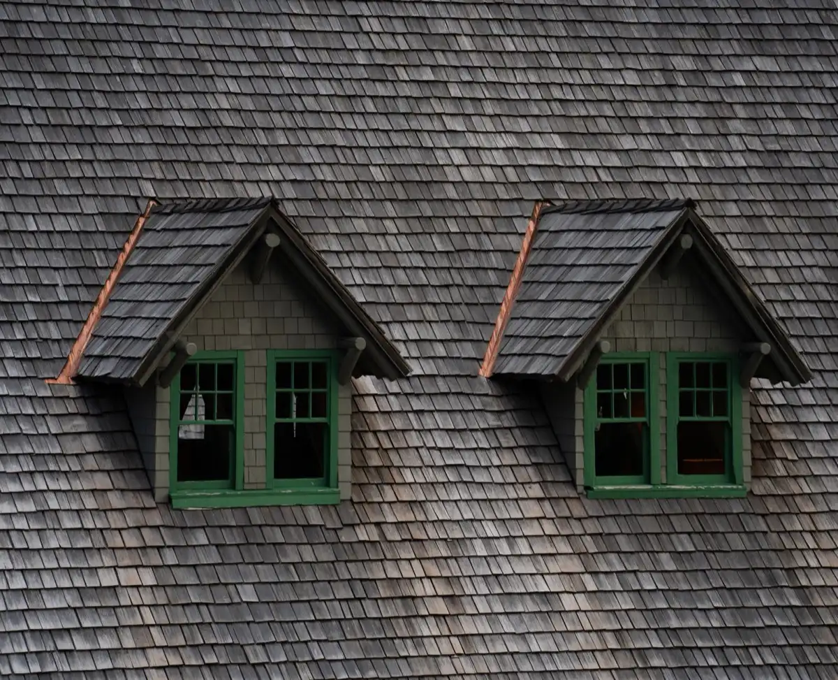 Dormers on a shingle roof in Henderson, NV, where step flashing and kickout flashing carry water past the walls